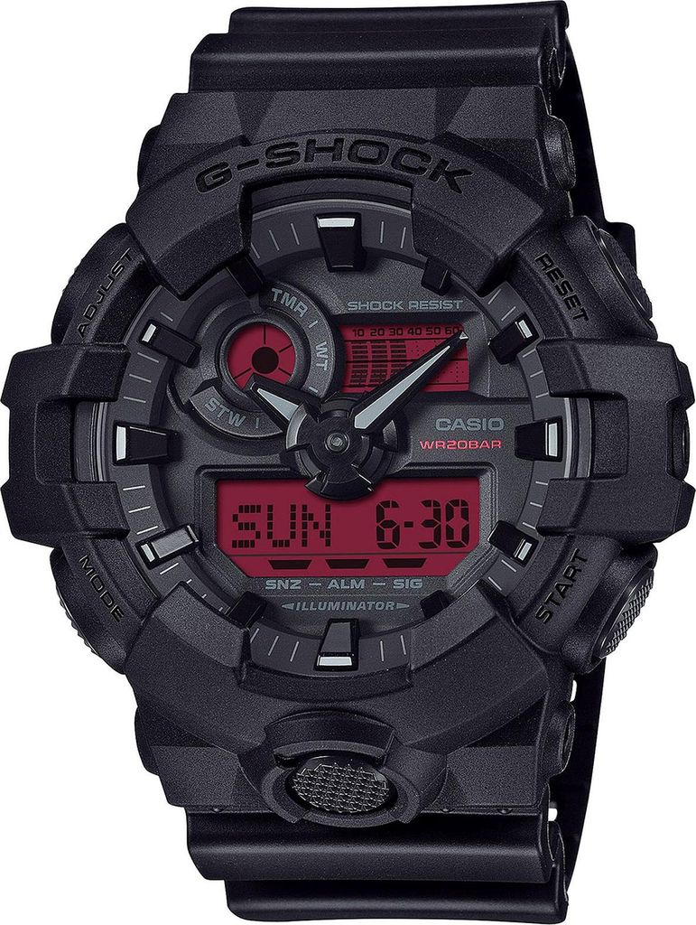 A close-up, front-facing studio shot of a black G-Shock digital watch with a red display.