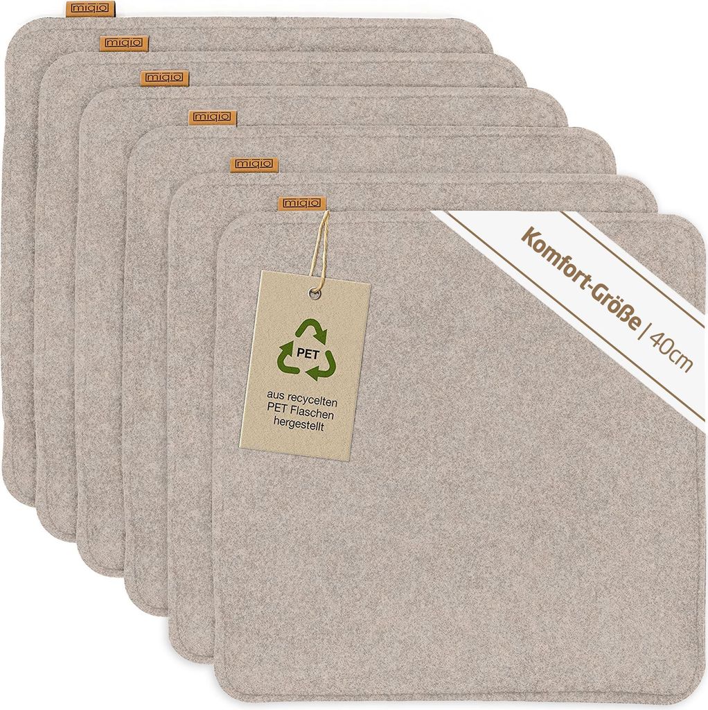 A stack of beige felt placemats with a tag and a diagonal banner.