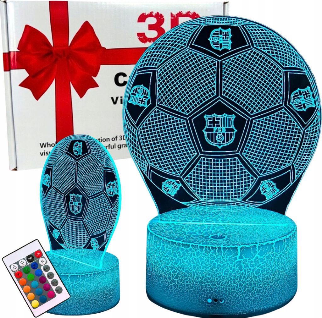 A product shot of two 3D LED lamps shaped like soccer balls, one larger than the other, placed next to a gift box with a red ribbon. A remote control is also visible. The lamps are illuminated with blue light.