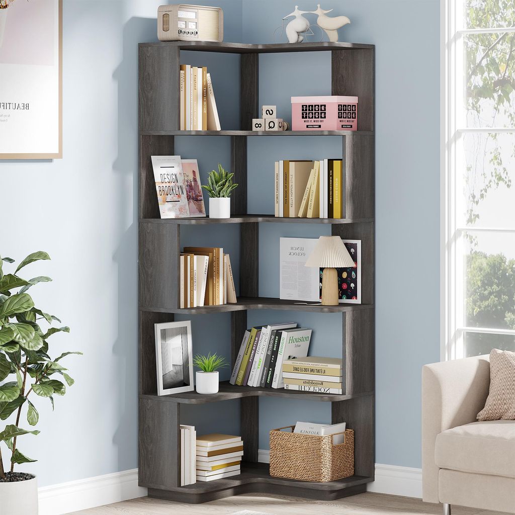 A corner bookshelf filled with books and decorative items, placed in a room with light blue walls and a window.