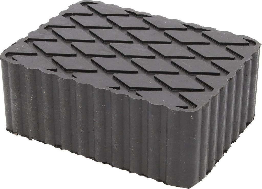 A black rubber jack pad with a diamond pattern on top and ribbed sides, isolated on a white background.