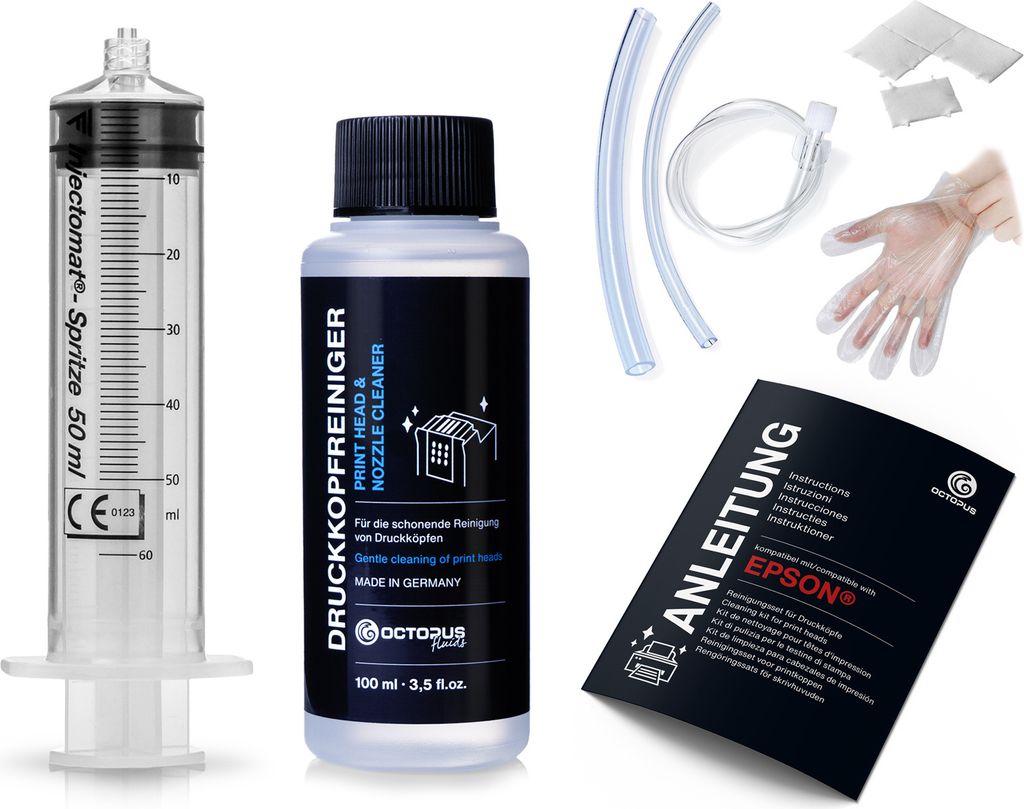 A collection of items for cleaning printer heads, including a syringe, cleaning fluid, tubing, gloves, and instructions.