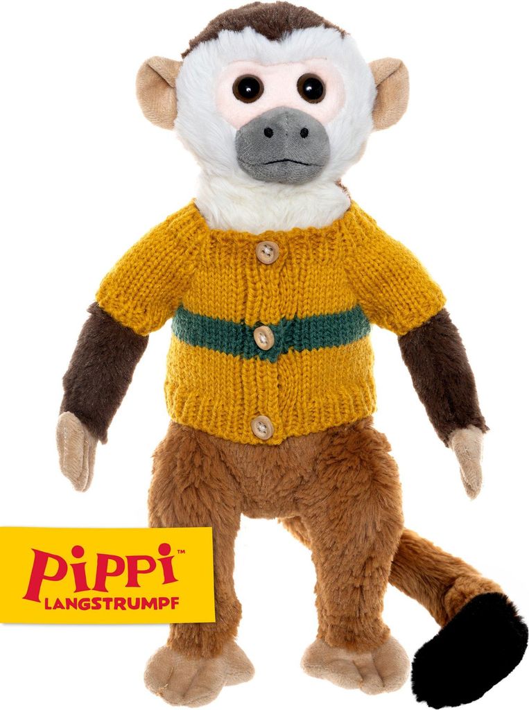 A stuffed toy monkey wearing a sweater.