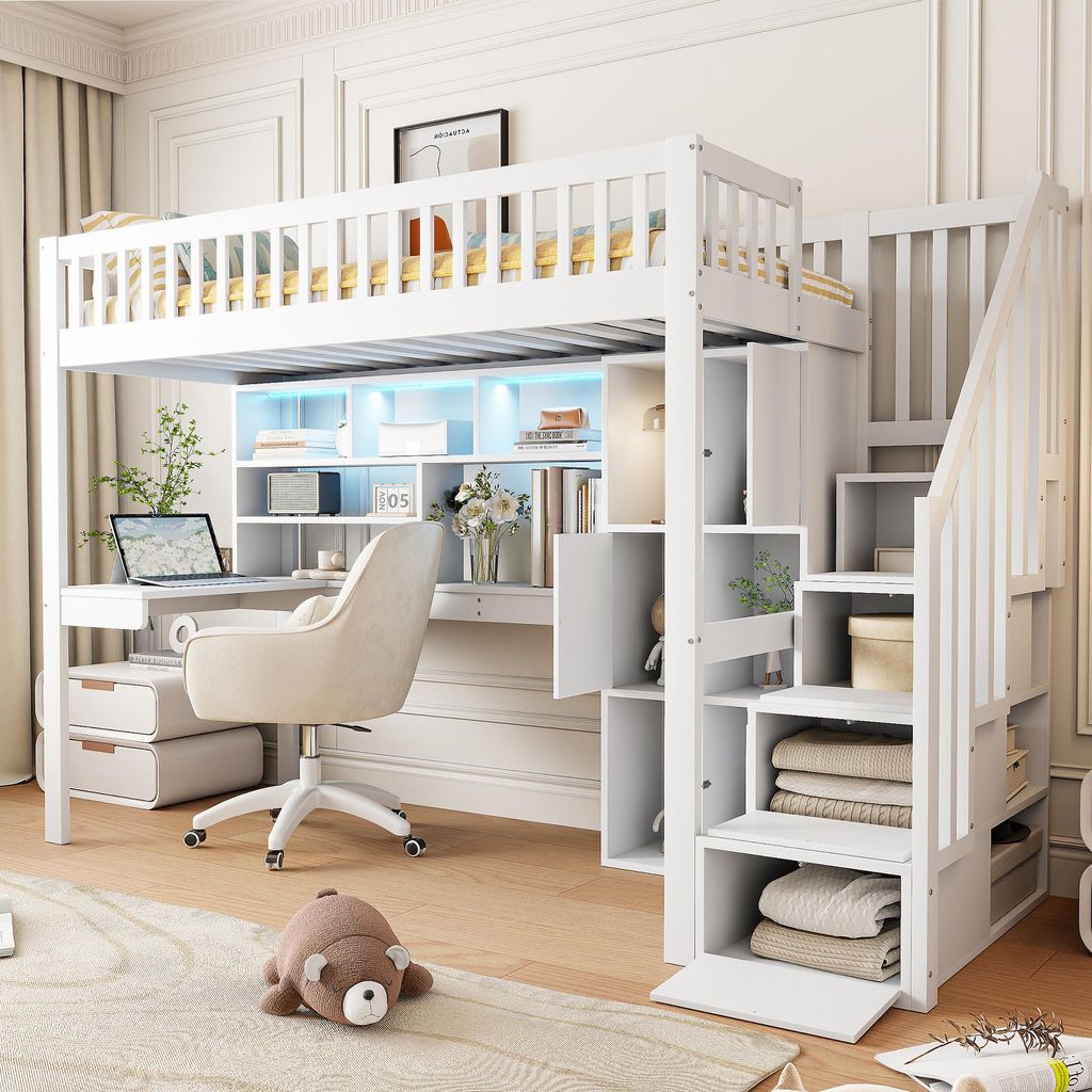 A white loft bed with a desk and storage integrated into the stairs, set up in a bedroom.