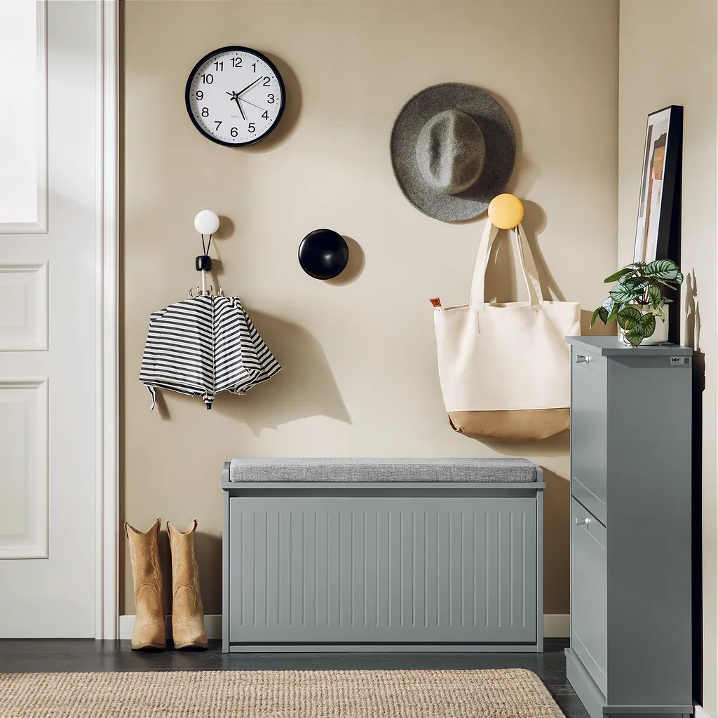 Commode à chaussures grise avec coussin d'assise et rangement compact