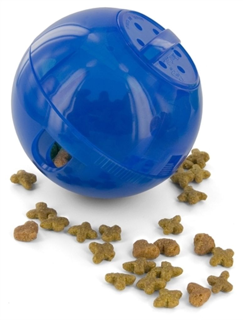A blue pet treat dispensing ball with kibble scattered around it on a white background.