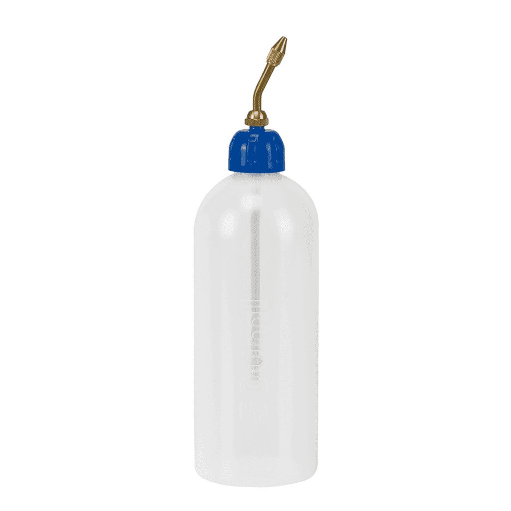 A clear studio shot of an oil can.