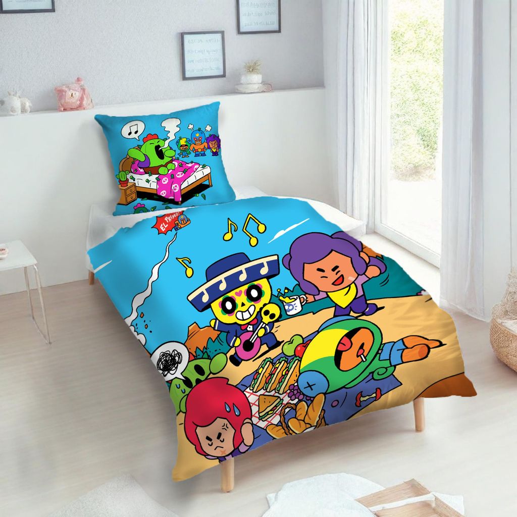 A child's bed with a comforter and pillow featuring cartoon characters.
