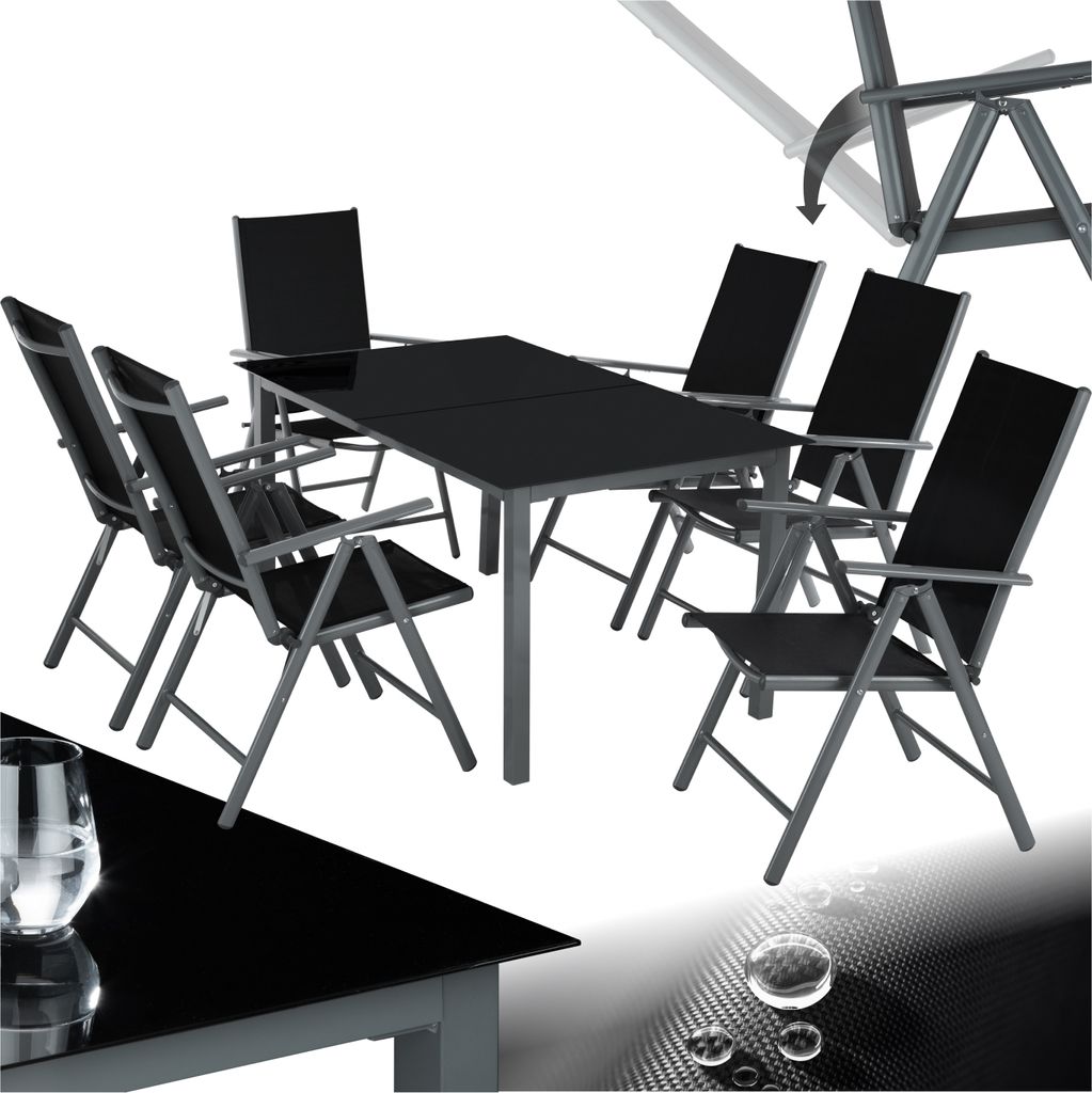 A black dining set with a glass table and six chairs, set against a white background.