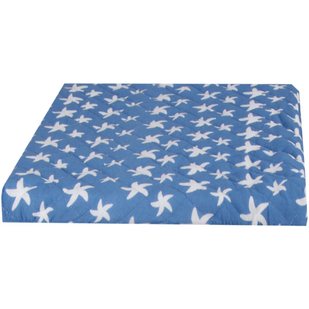 A blue quilted cover with white star patterns, shown from a side angle.