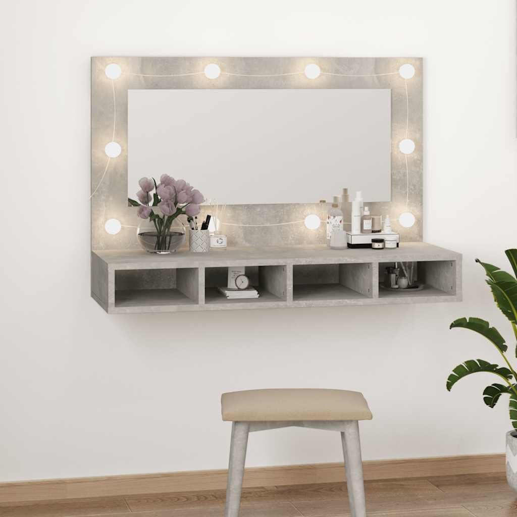 A vanity mirror with integrated storage and LED lights, mounted on a wall.