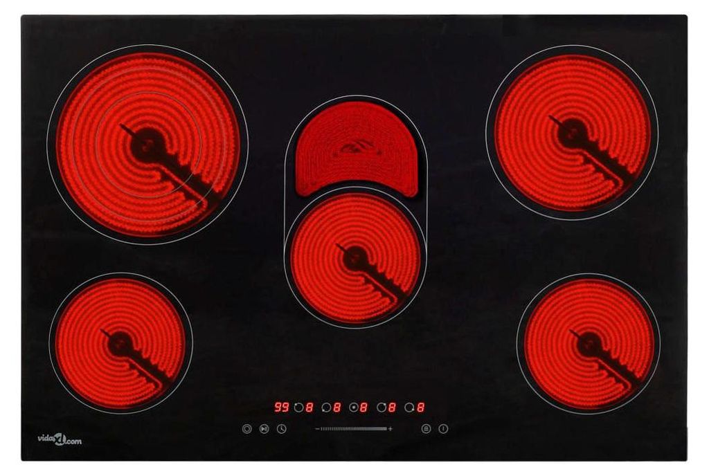 A top-down view of a black glass-ceramic cooktop with five heating elements that are glowing red.