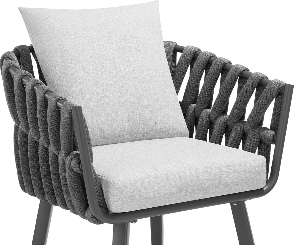 A close-up view of a modern chair with a woven back and seat cushions.