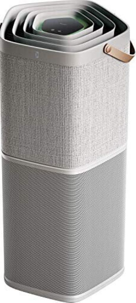 A modern air purifier with a layered, square design and a fabric-wrapped body.