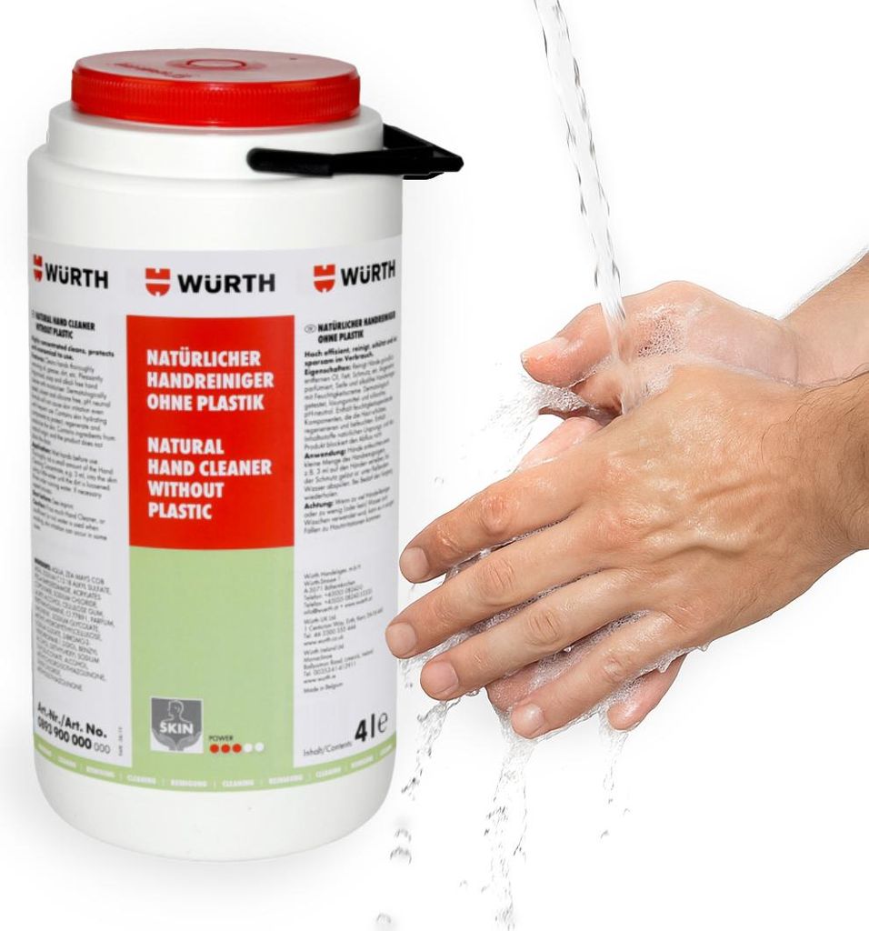 Hands being washed under running water next to a large container of hand cleaner.