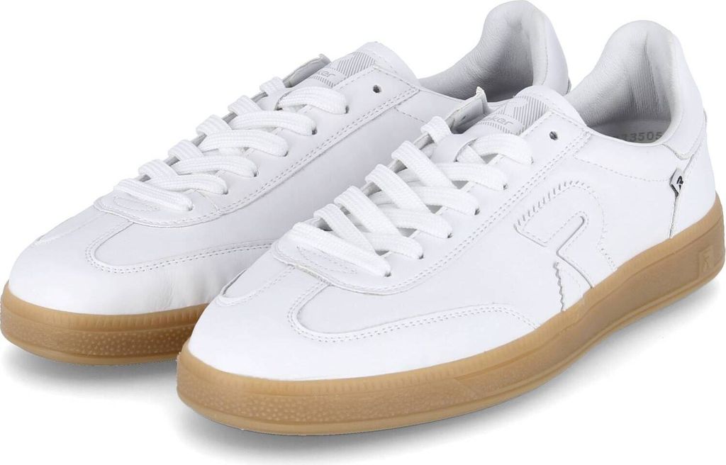 A pair of white athletic shoes with brown soles.