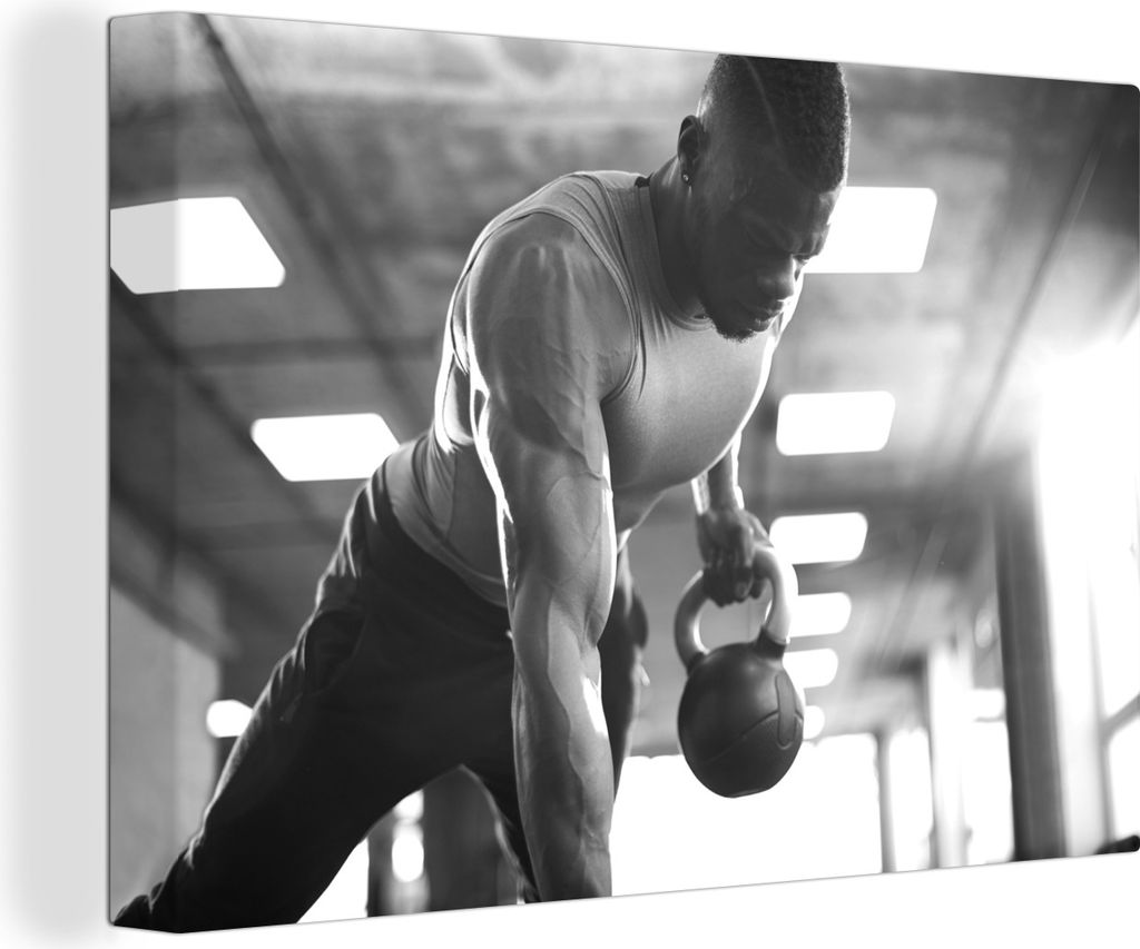 OneMillionCanvasses - Leinwandbilder - 140x90 cm, Ein starker Mann hebt Kettlebells beim Fitness - schwarz und weiß, Wandbilder Kunstdruck Wandd...