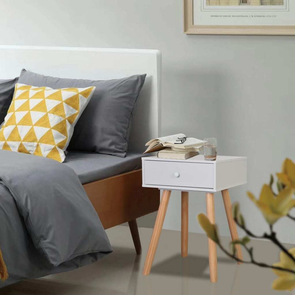 A bedroom scene with a bed and a nightstand.