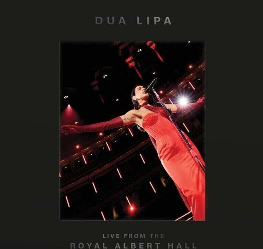 Dua Lipa performing live on stage at the Royal Albert Hall.