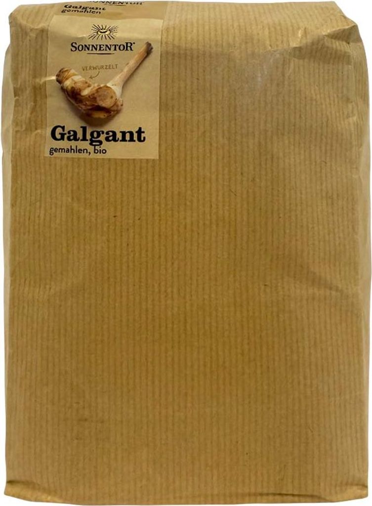 A brown paper bag containing ground galangal.