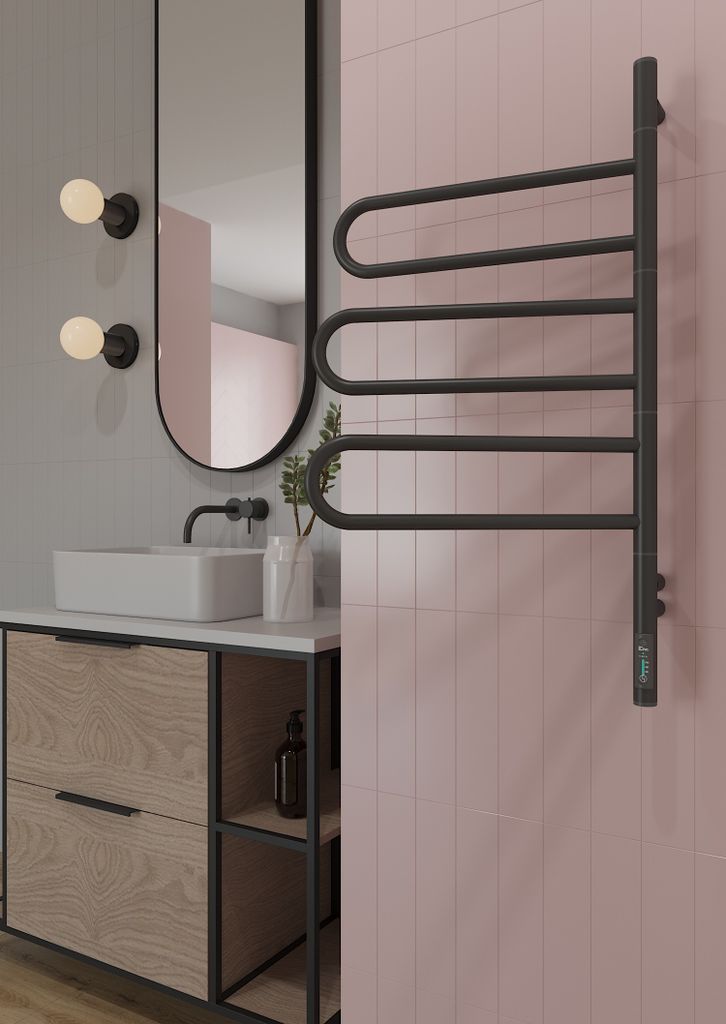A modern bathroom setting with a vanity, sink, mirror, and a towel warmer.