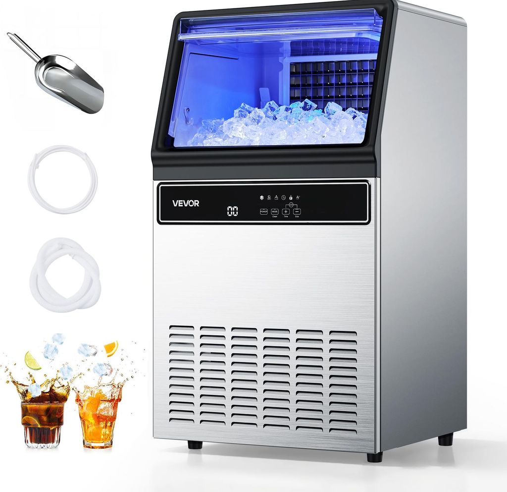 A commercial ice maker with ice cubes inside and accessories.