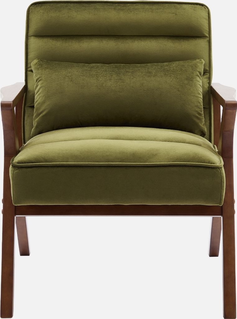 A studio shot of a green velvet armchair with wooden legs.