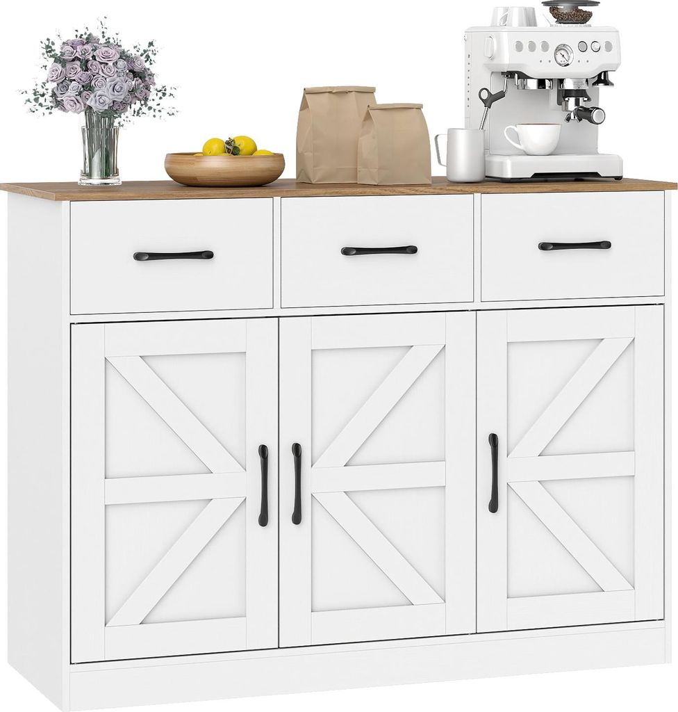 A white sideboard with a wooden top, featuring three drawers and three cabinet doors with a barn door design. It is decorated with a vase of flowers, a bowl of lemons, and two paper bags on top, along with a white espresso machine.