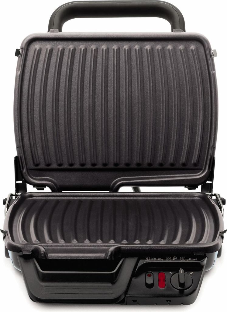 An open electric grill on a white background.