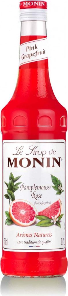 A bottle of Monin Pink Grapefruit syrup.