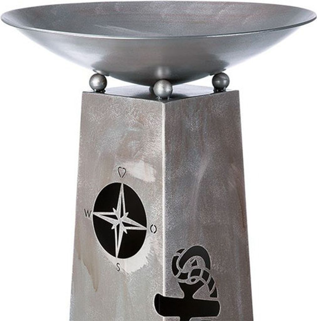 A metallic stand with nautical motifs, likely for decorative purposes.
