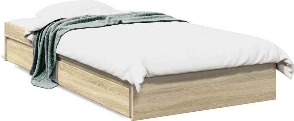 A bed frame with drawers and a blanket.