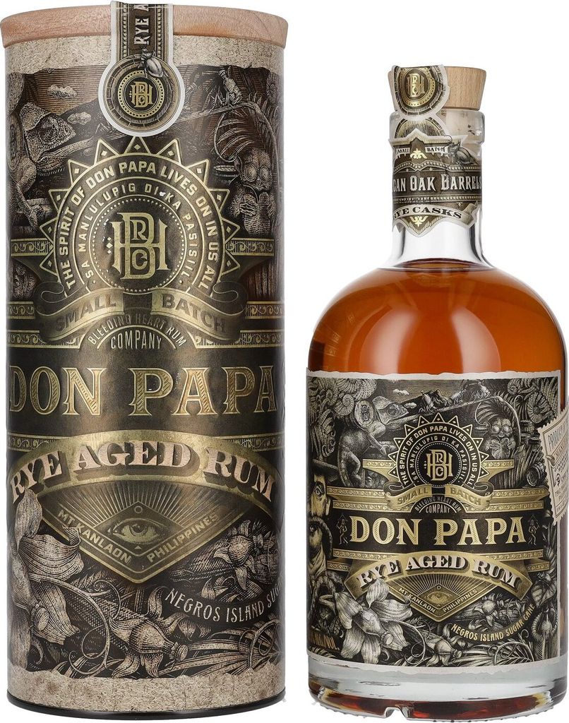 A bottle of Don Papa Rye Aged Rum and its cylindrical packaging are displayed against a white background.