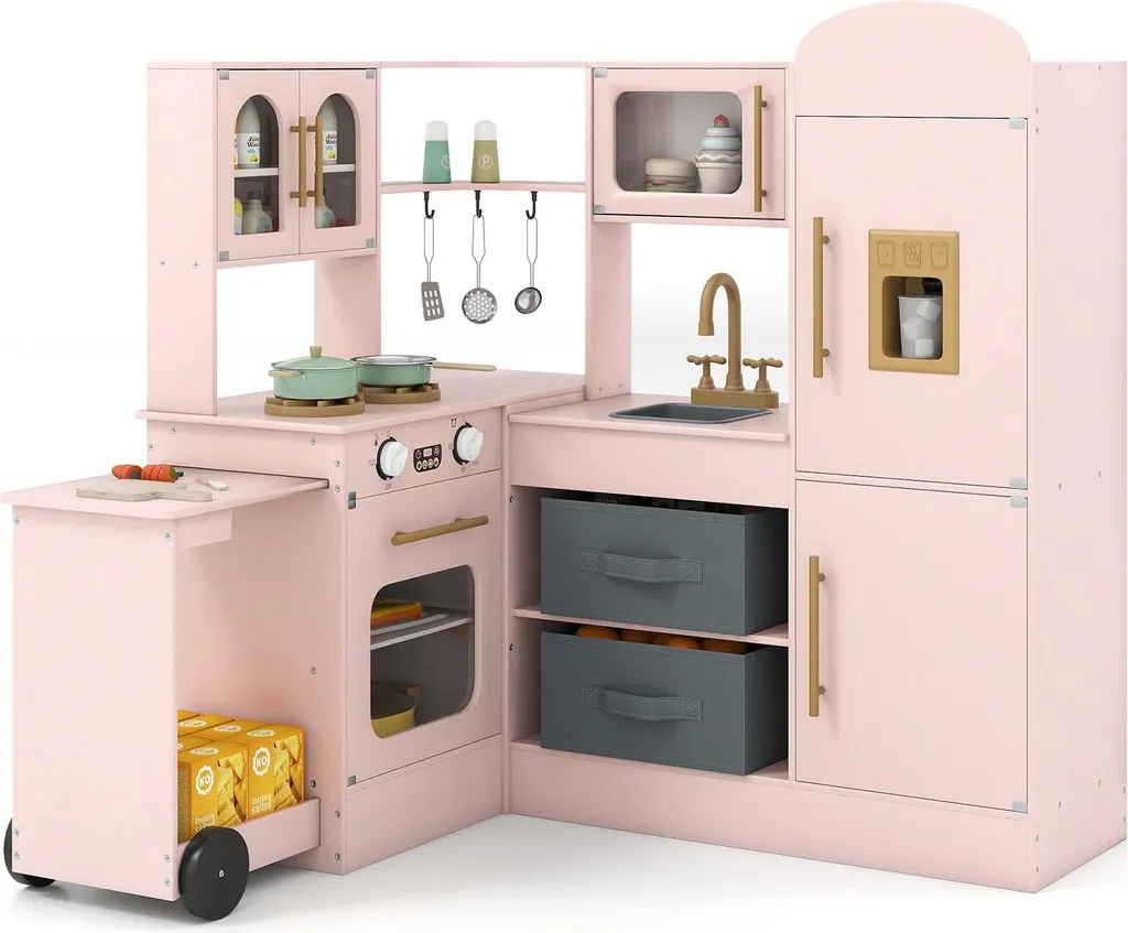 Cuisine d'angle enfant en bois rose avec plan de travail coulissant