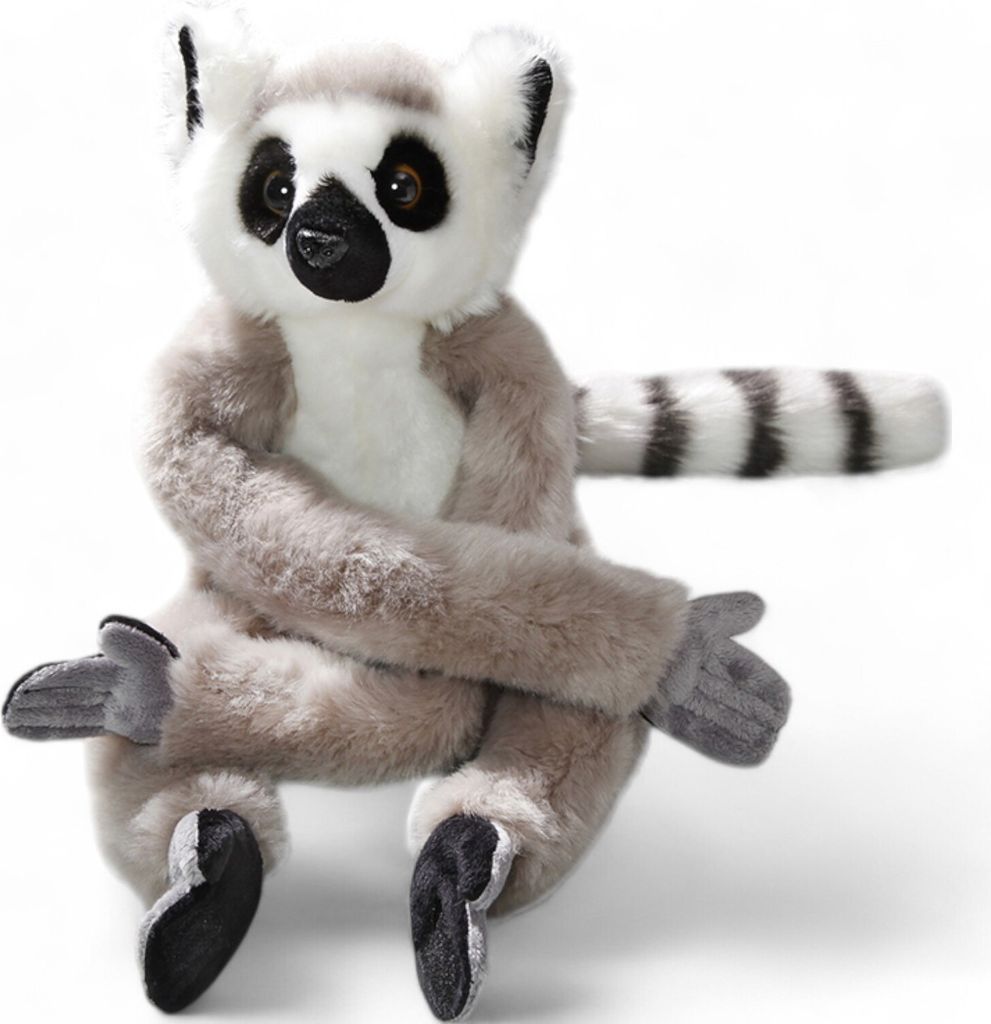 A plush toy lemur is sitting against a white background.