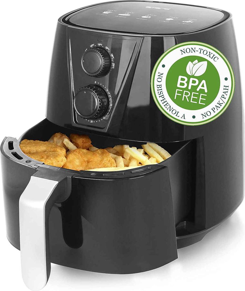 A black air fryer filled with chicken nuggets and french fries.