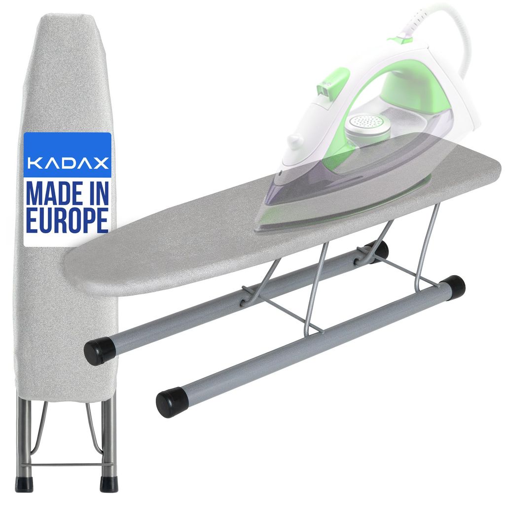 A small ironing board with an iron on it, and a folded ironing board cover next to it.