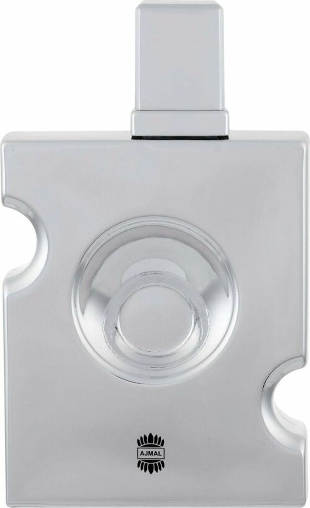 A silver perfume bottle with a square design and a circular indentation in the center.