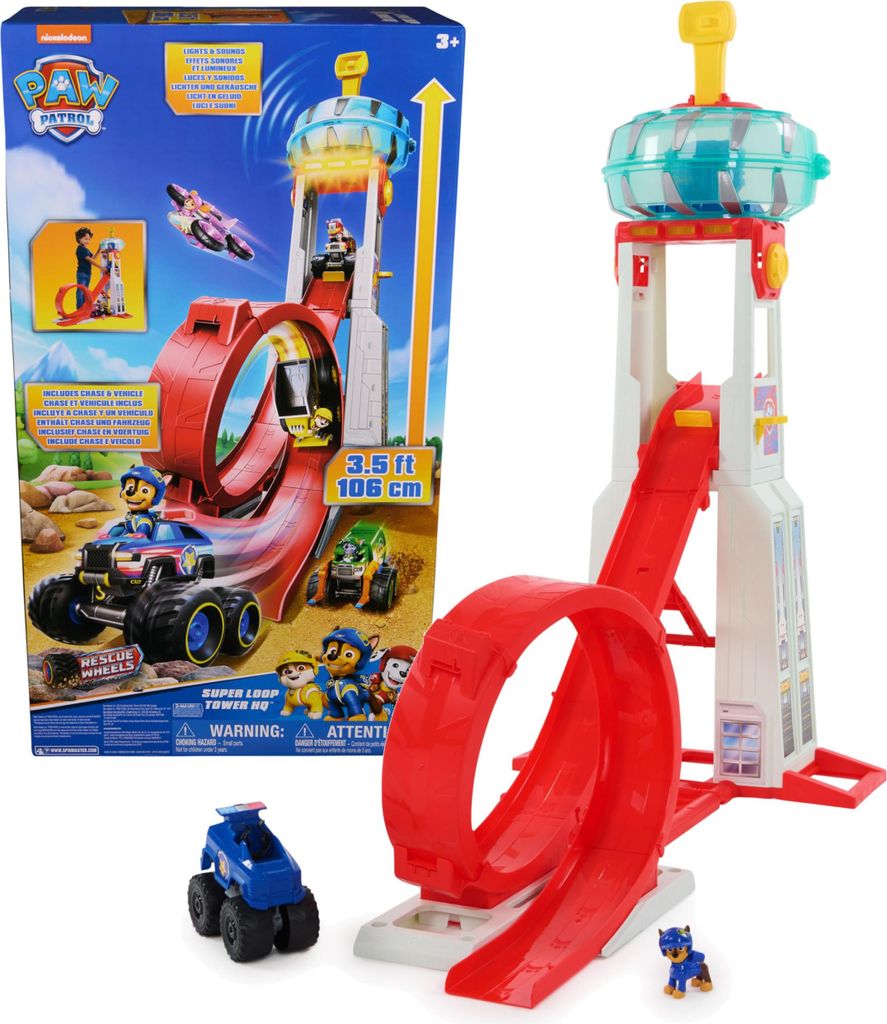 A Paw Patrol toy playset with a tower and loop-de-loop track, shown with its packaging.