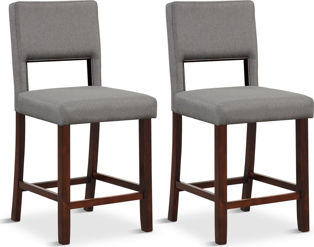 Two gray upholstered bar stools with dark wooden legs are shown against a white background.