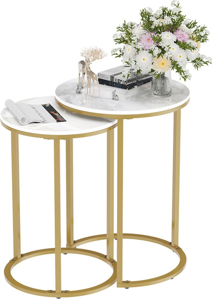 Two nesting round side tables with marble-look tops and gold metal frames, decorated with a bouquet of flowers, a decorative deer figurine, and books.