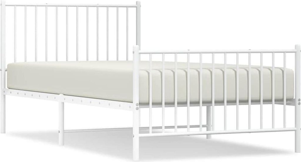 A white metal bed frame with a mattress.