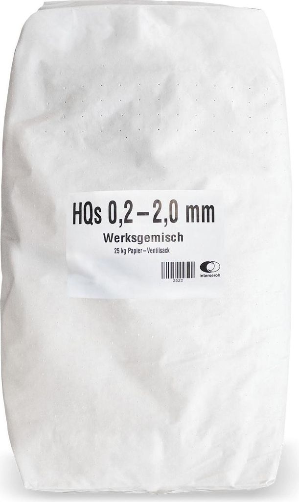 A white paper bag filled with granular material, with a label on the front.