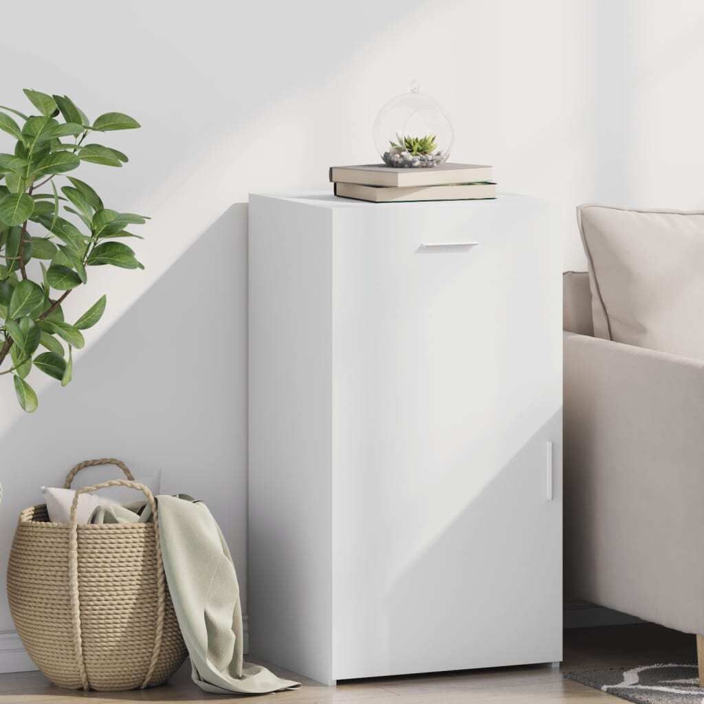A white sideboard is placed next to a sofa, with a basket of items and a plant nearby.