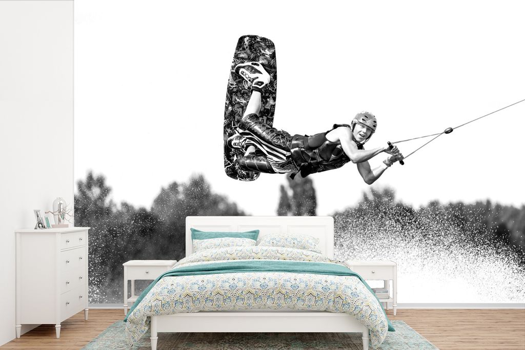 MuchoWow Fototapete für Wohnzimmer oder Schlafzimmer Wandtapete Vinyl Motivtapete Eine junge Wakeboarderin fliegt über ihre selbstgemachte Spri...