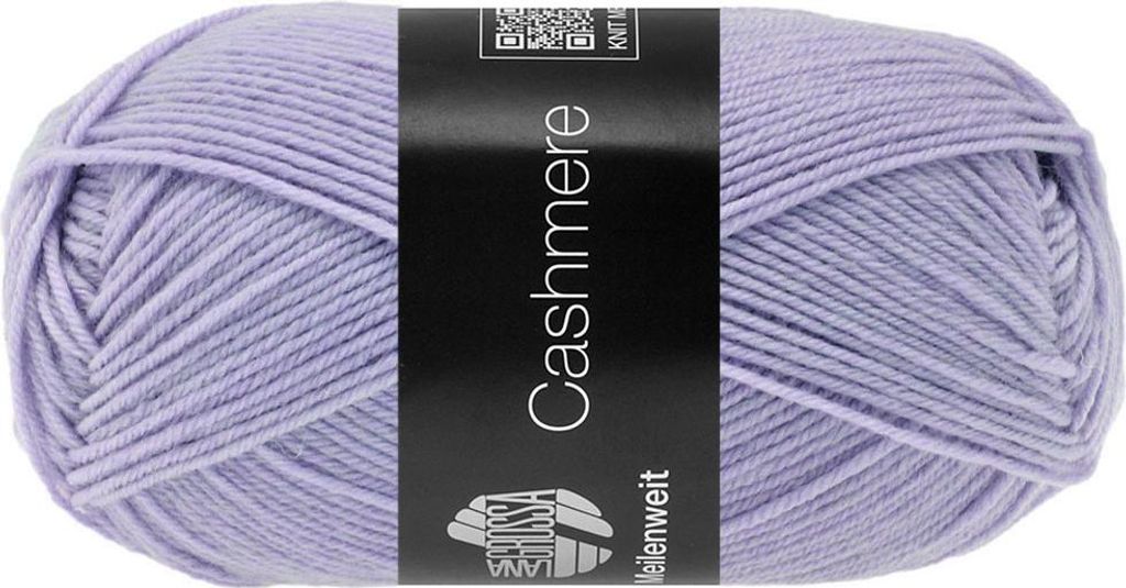 A ball of purple yarn with a black label wrapped around it.