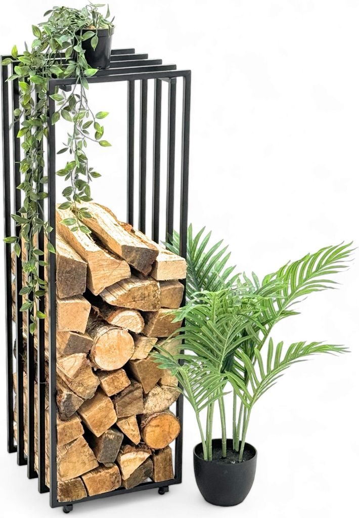 A black metal firewood rack filled with logs, next to a potted plant.