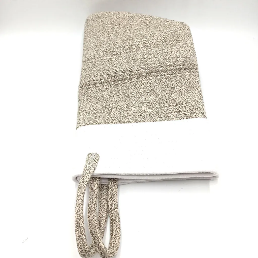 Panier à linge tressé artisanal en coton avec poignées intégrées