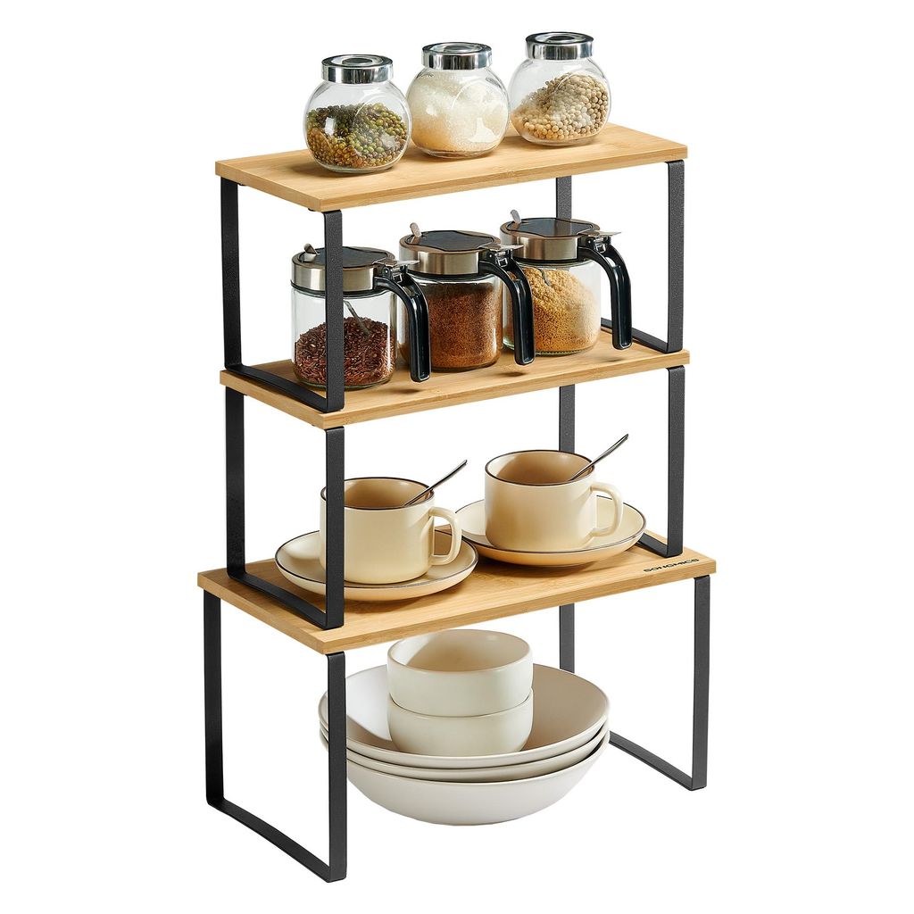 A three-tiered shelf unit holding kitchenware and spices, presented against a white background.