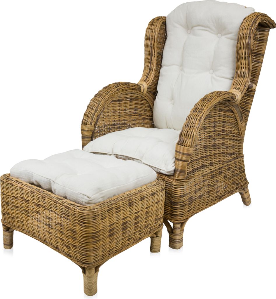 A wicker armchair with a matching ottoman, both with white cushions, is shown against a white background.